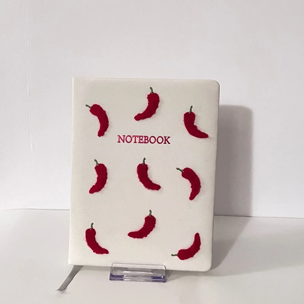 White Notebook with Red Chili Peppers